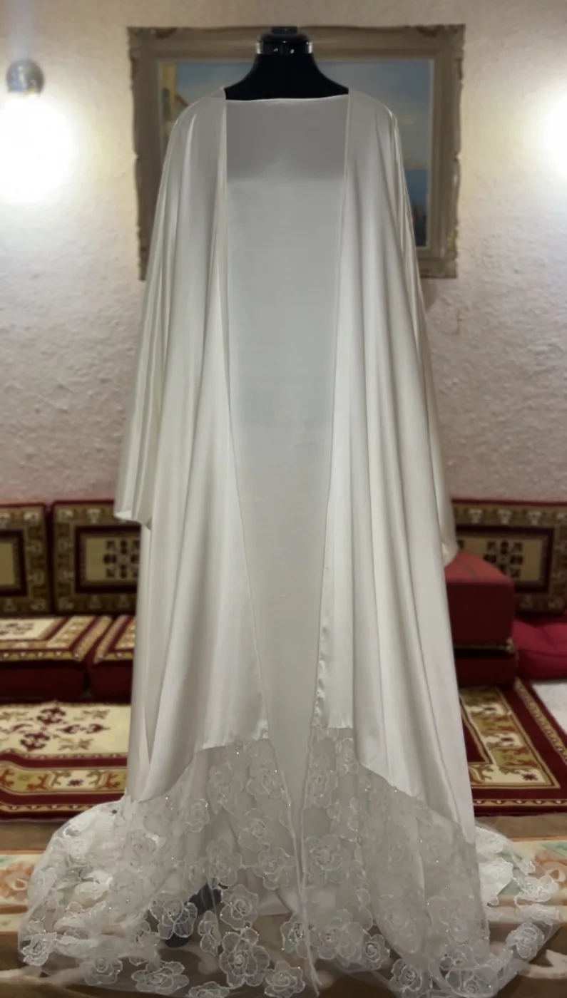 White bridal cape gown with lace train