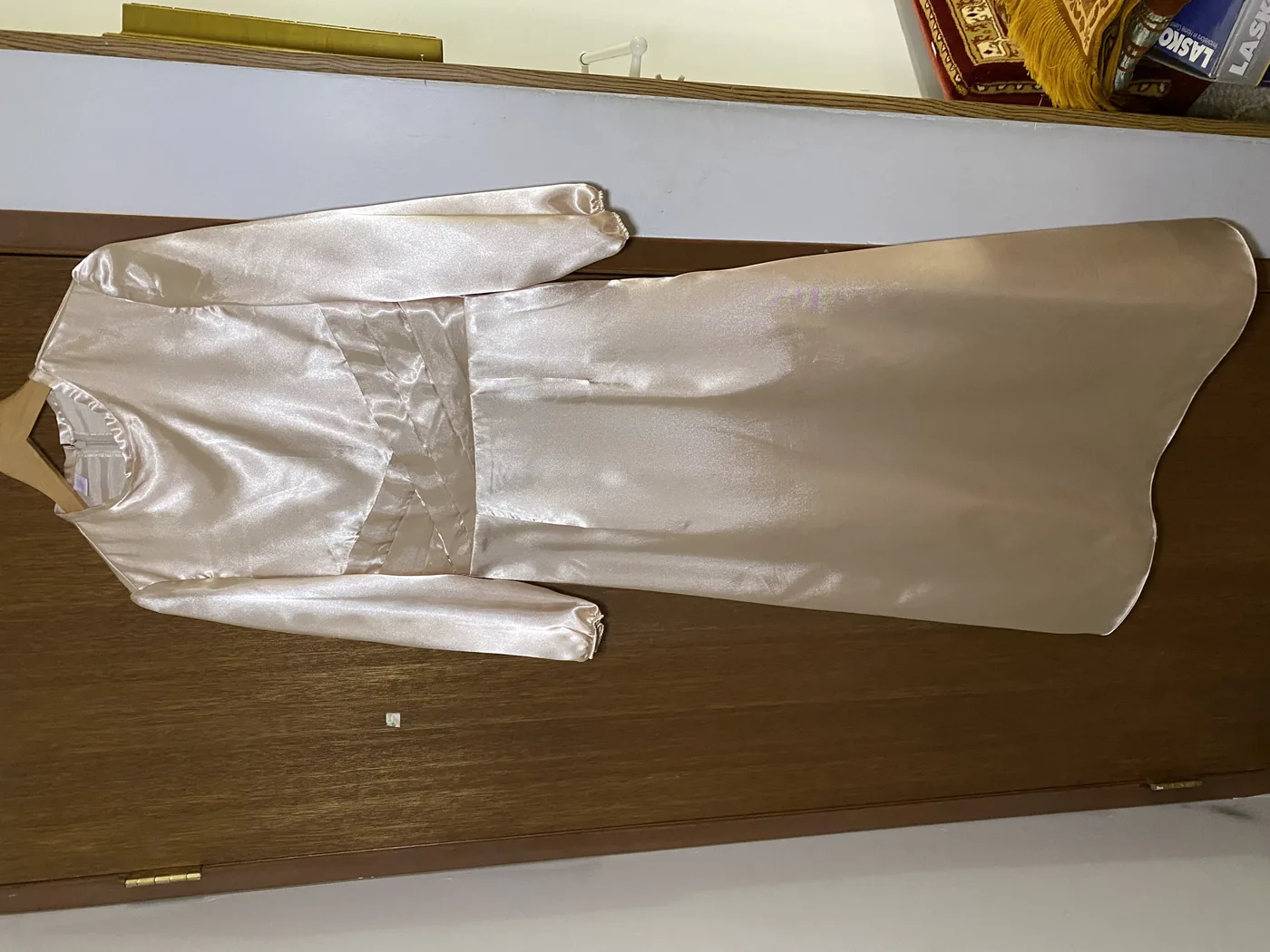 Champagne gold satin gown with a crossover pleated waist