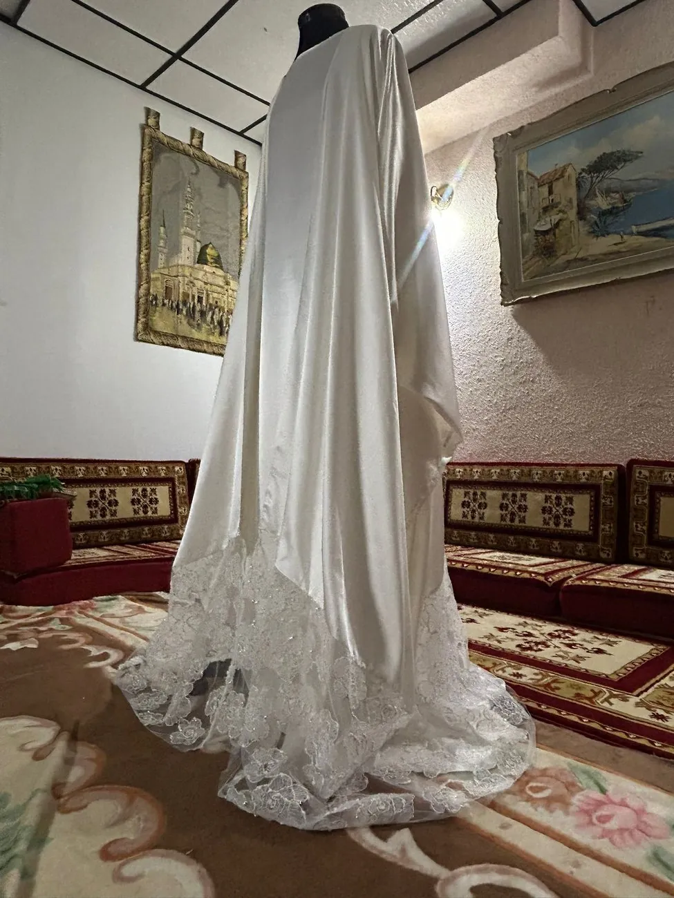 Side view of the bridal gown showing the lace train